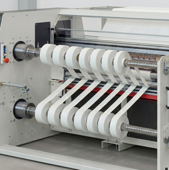 Slitting machine with white slit rolls on the winding shafts