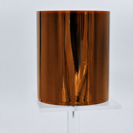 6051 PI-film - an upright roll of amber polyimide film on a clear display stand.