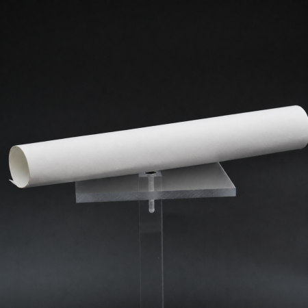 FRB-NT - a rolled sheet of white flame-barrier insulation material on a clear display stand.
