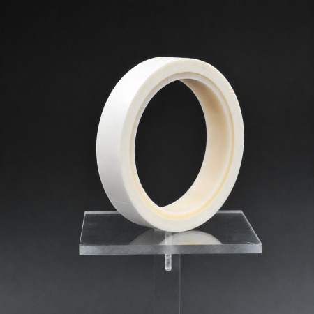 Atsite&trade; 5040 - a white roll of aramid-paper electrical insulation tape on a clear display stand.